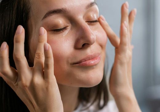 lady embracing a moment of self care by massaging eye cream into her face