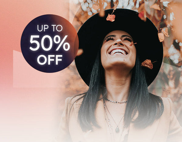 Woman wearing a sun hat with a promotional offer for up to 50% off on a blue and white background.