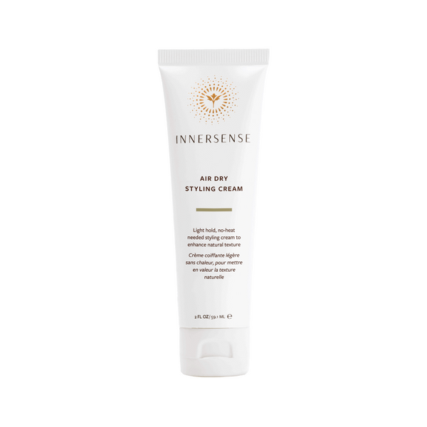Innersense air dry styling cream tube on a white background