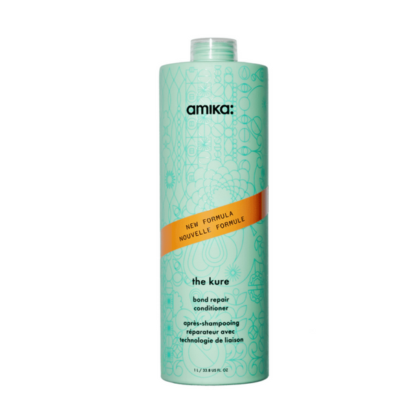 Amika 'the cure' bond repair conditioner bottle on a white background