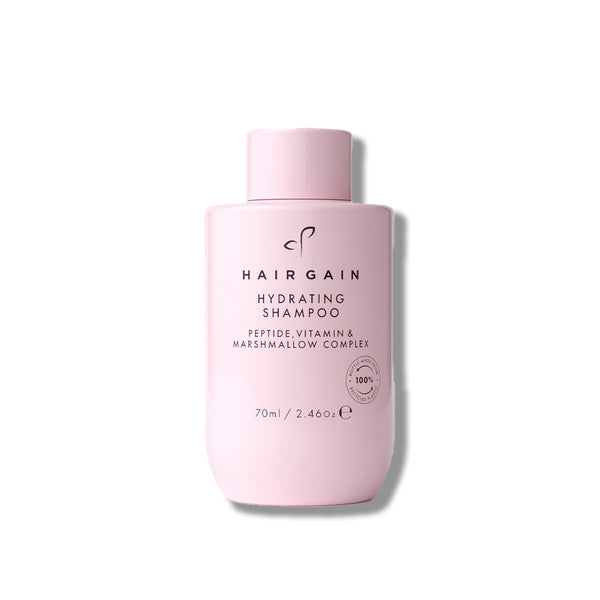 Pink bottle of Hair Gain Hydrating Shampoo on a white background