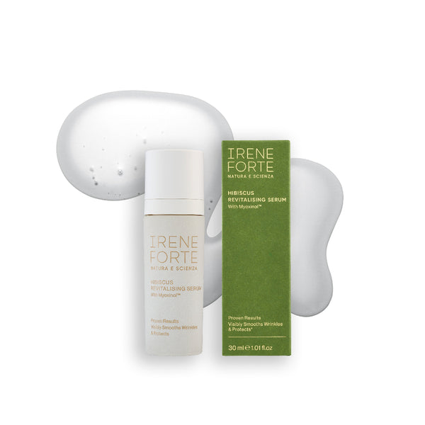 Irene Forte Hibiscus Revitalising Serum shown with its white bottle and green box packaging, set against a clean white background with decorative translucent gel shapes.