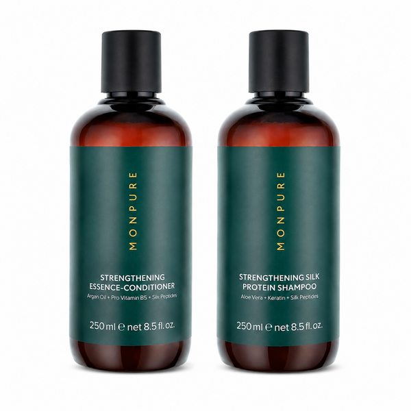 Two amber glass bottles of Monpure haircare products on a white background: Strengthening Essence-Conditioner on the left and Strengthening Silk Protein Shampoo on the right, both with dark green labels and black caps.