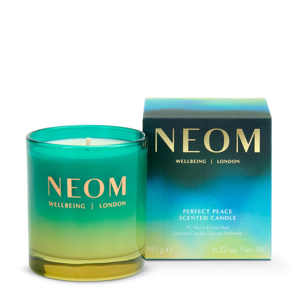 NEOM candle and packaging on a white background