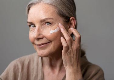 lady applying face cream to her face