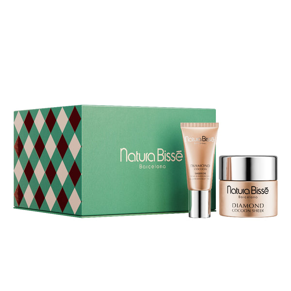 Natura Bissè by Nature beauty gift set featuring a green box with a red and beige diamond pattern, a beige tube of Diamond Color Corrector, and a beige jar of Diamond Colour Stick.