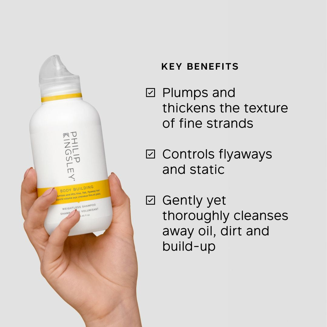 Hand holding a Philipley hair product bottle with key benefits listed on a light gray background
