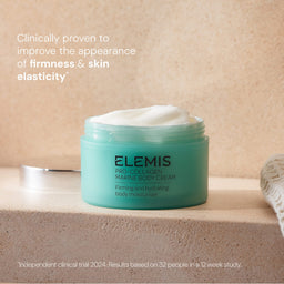 Elemis Pro-Collagen Marine Body Cream in a mint green jar with white cream visible at the top, placed on a beige stone surface with promotional text on a warm beige background.