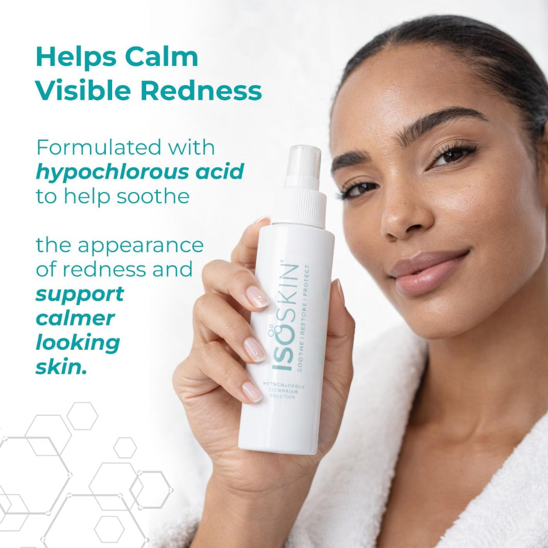 Woman holding a bottle of ISO Skin product with text about calming visible redness.