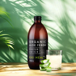 Bottle of Organic Aloe Ferox Fresh Juice from Kiki Health on a wooden surface with green leaves in the background.