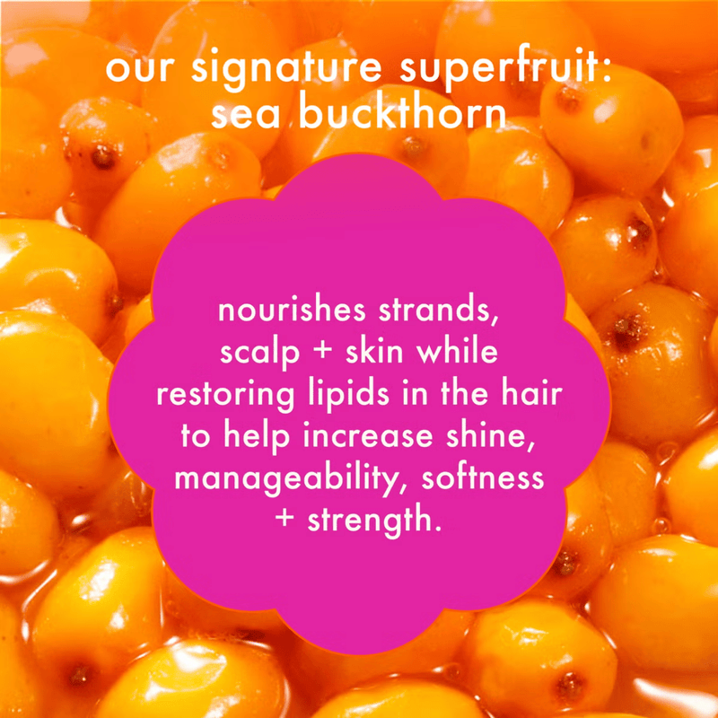 Close-up of sea buckthorn berries with promotional text about their benefits for hair health.