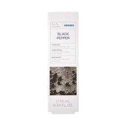 A tall, narrow white box for KORRES Black Pepper Eau De Toilette, featuring a textured black and gray image of peppercorns on the front, set against a plain white background.