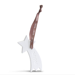 A white ceramic shooting star Christmas ornament with the word 'NEON' embossed on its tail, featuring a brown ribbon hanger printed with 'Merry Christmas in Neon'.