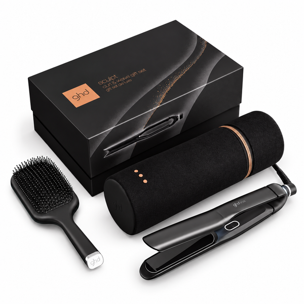 Ghda Squid hair styling gift set including a black flat iron, black paddle brush, and black cylindrical hair dryer cover with metallic rose gold accents, displayed with its black retail box on a white background.