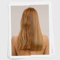 Long, straight, brown hair on a neutral background