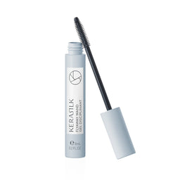 Eyelash serum with applicator on a white background