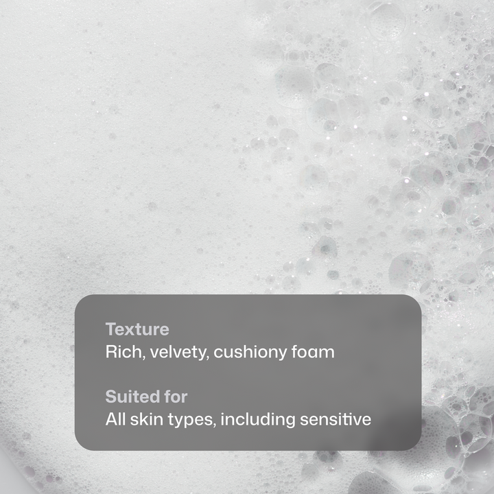 Close-up of a rich, velvety cushiony foam texture with bubbles and overlaid text reading 'Texture Rich, velvety, cushiony foam' and 'Suited for All skin types, including sensitive'.