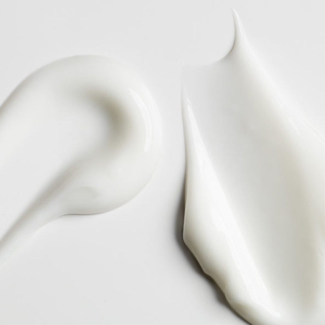 Close-up of white fabric with a soft texture on a light gray background