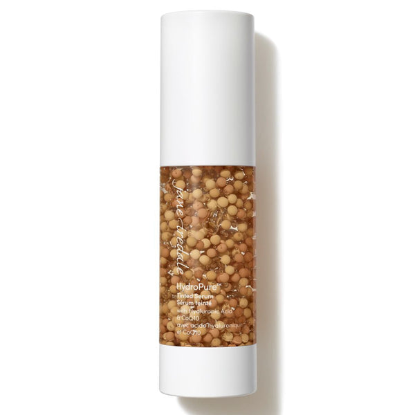 A single cosmetic tube of Paula Begun Brighten & Lift Hyalucre with a white cap and base, featuring a clear center section filled with golden-brown lifting beads, on a white background with a soft shadow.
