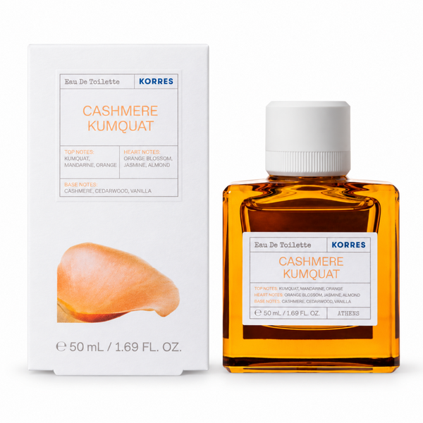 A bottle of Korres Cashmere Kumquat Eau De Toilette next to its white packaging box, featuring an orange graphic of a kumquat fruit on the label.