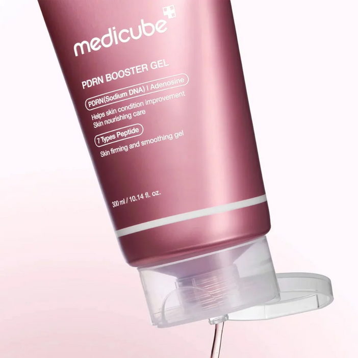 Medicube PDRN Booster Gel tube on a light pink background