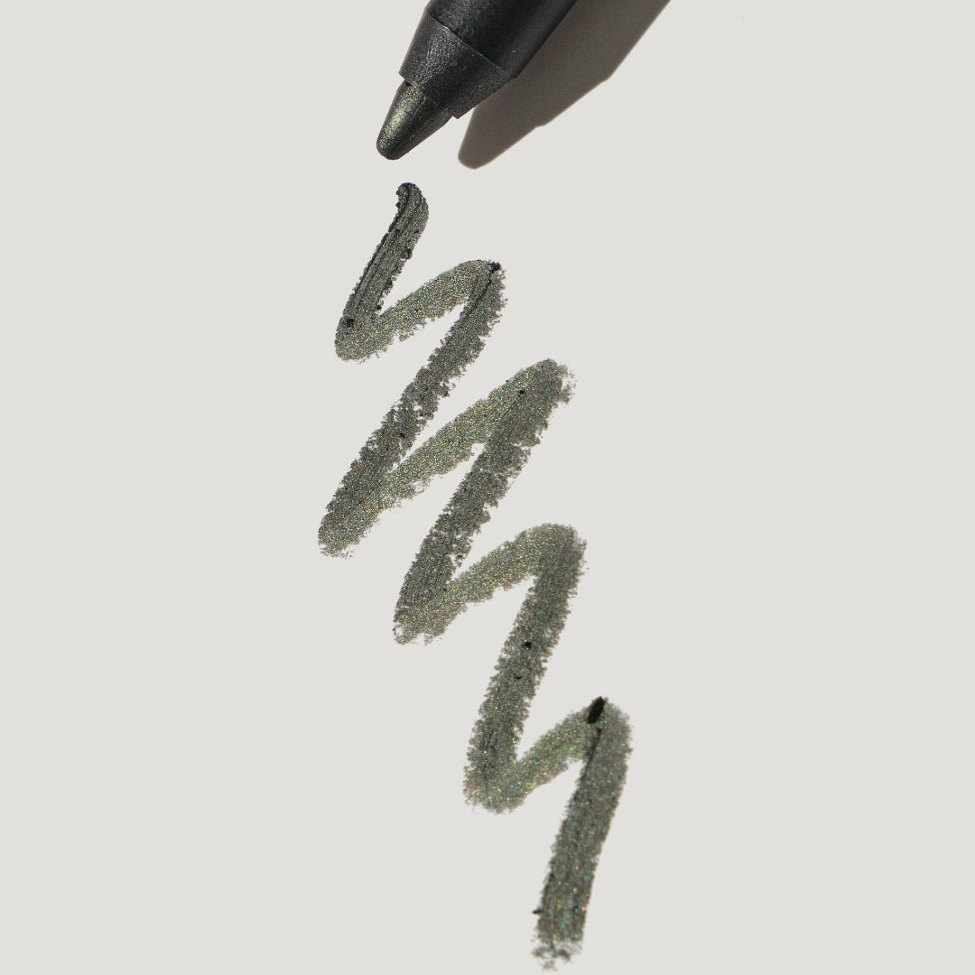 Black marker pen drawing zigzag lines on a light gray background