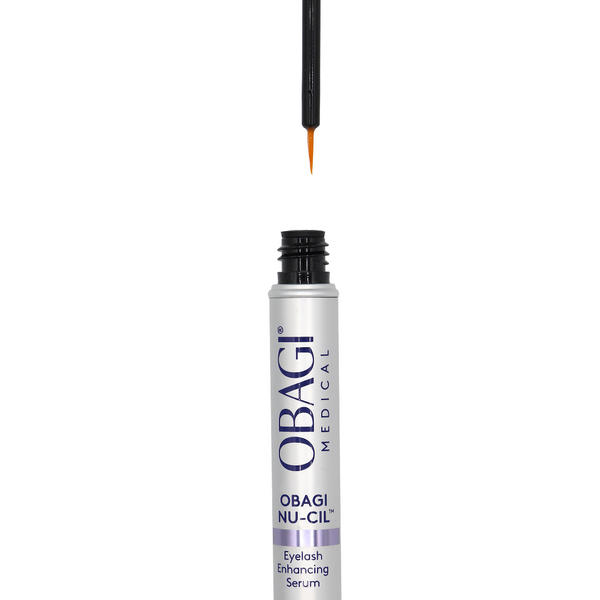 Obagi Nu-Gil eyelash enhancing serum with applicator on a white background