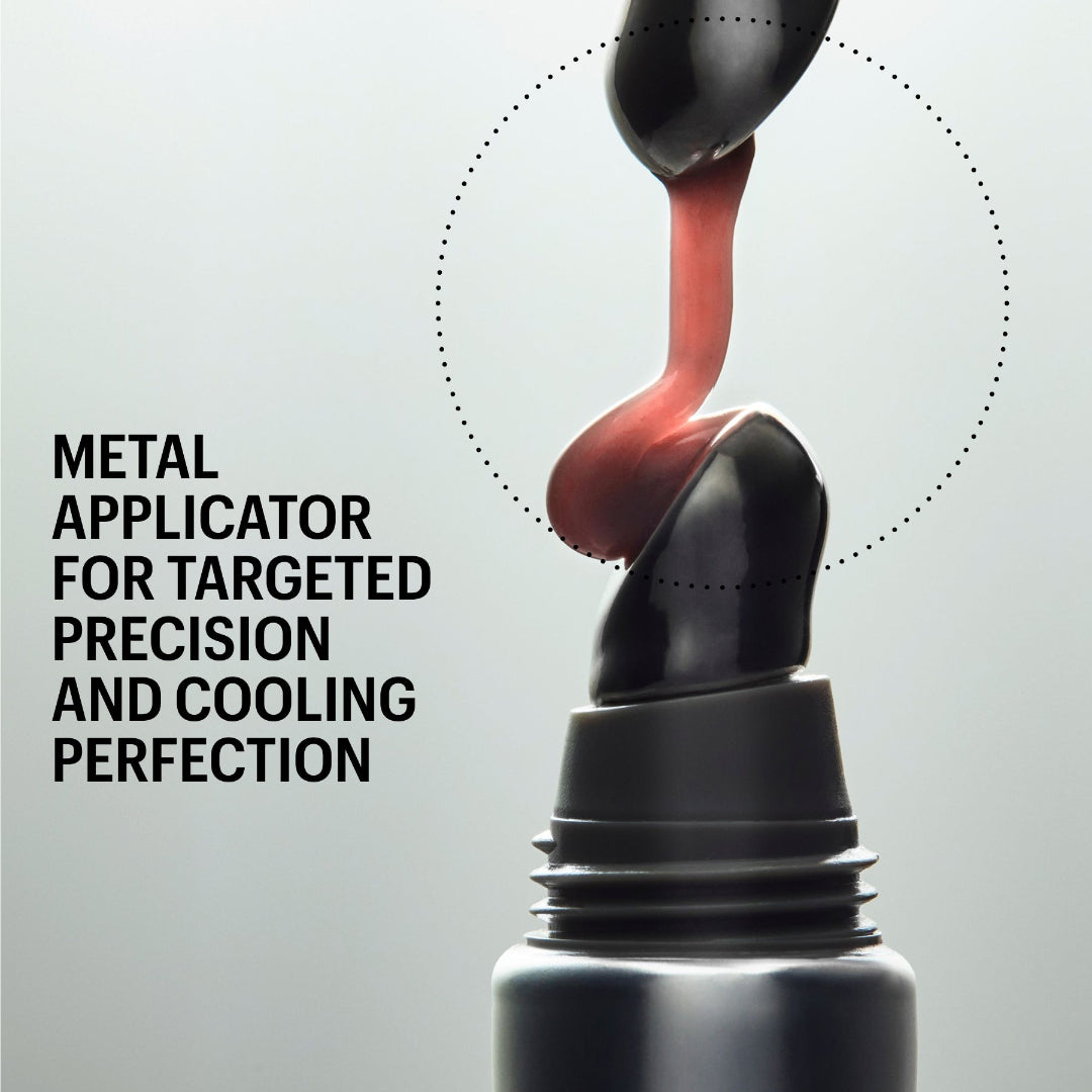 A close-up promotional shot of a black metal makeup applicator being pressed into a dark cosmetic tube, with a pink-red product being dispensed. Text on the left reads 'METAL APPLICATOR FOR TARGETED PRECISION AND COOLING PERFECTION' and 'SHADE UTOPIA' appears at the top.