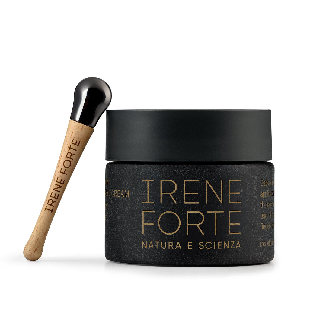 Black jar of Irene Forte cream with a wooden applicator on a white background