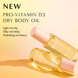 Pro-Vitamin D3 dry body oil with a pump on a beige background