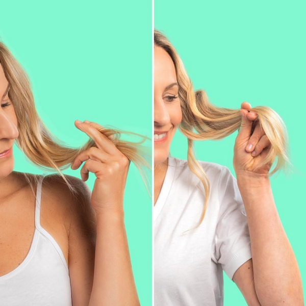 Two women comparing their hair against a teal background
