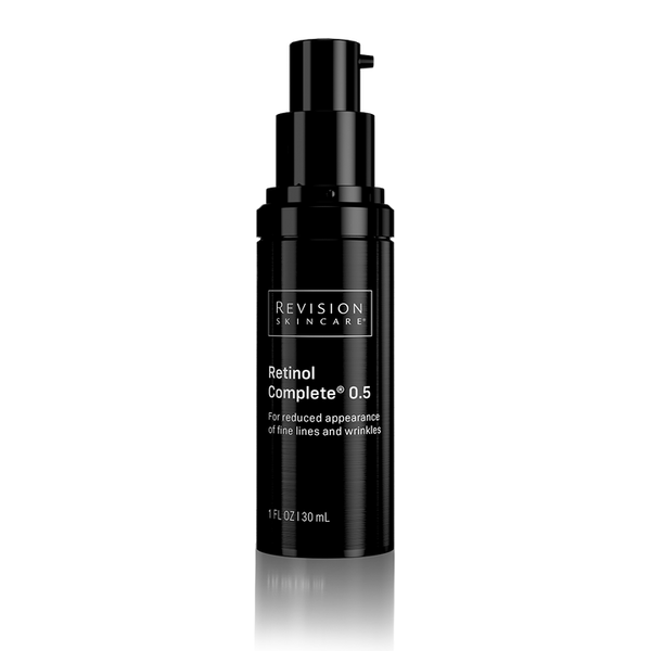 A black pump bottle of Revision Skincare Retinol Complete 0.5 on a clean white background with a subtle reflection below.