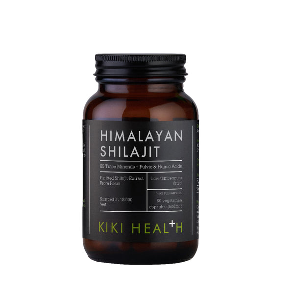 A dark amber glass bottle of Kiki Health Himalayan Shilajit with a black cap and a black label featuring white and lime green text, set against a plain white background.