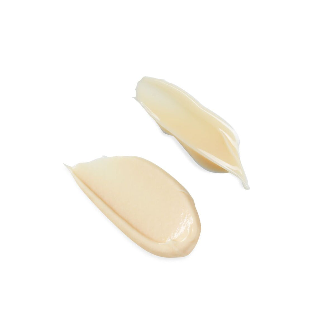 Two garlic cloves on a white background