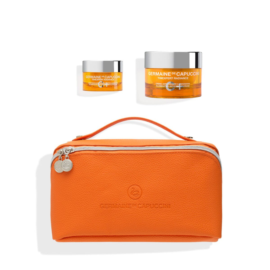Two jars of Germaine de Capuccini skincare product with an orange pouch on a white background