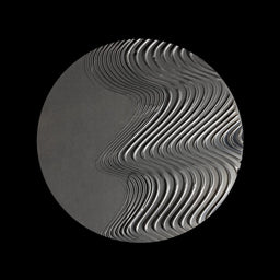 A circular gray object with a wavy, layered ribbed pattern on a solid black background.
