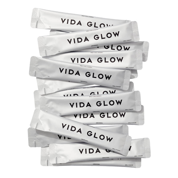 Stack of Vida Glow packets on a white background