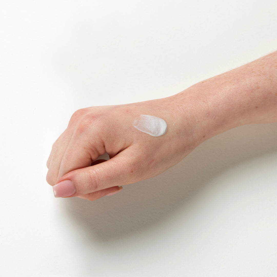 Ultrasun Face SPF 30 50ml applied to hand