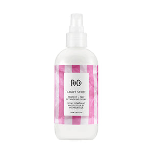 R+Co Candy Stripe hair spray bottle with pink and white checkered design on a white background