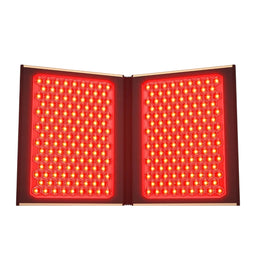An open red light therapy panel with two large rectangular grids of glowing red LEDs, shown against a plain white background.