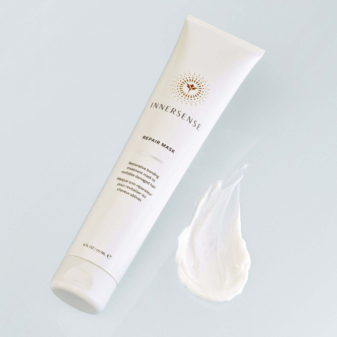 Innersense repair mask tube with a sample on a light gray background