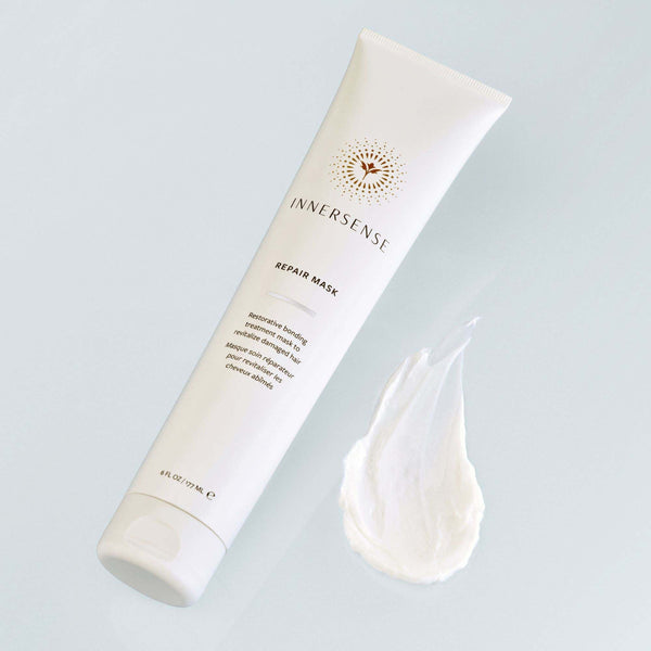 Innersense repair mask tube with a sample on a light gray background