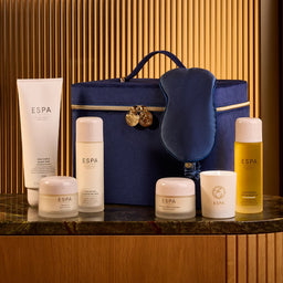ESPÓa skincare products with a blue bag on a wooden background