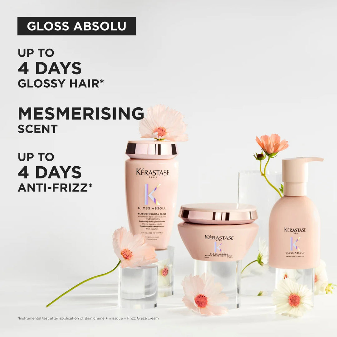 Kérastase hair care products with flowers on a light background