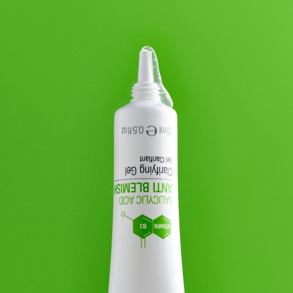 Spot gel emerging from white tube on green background